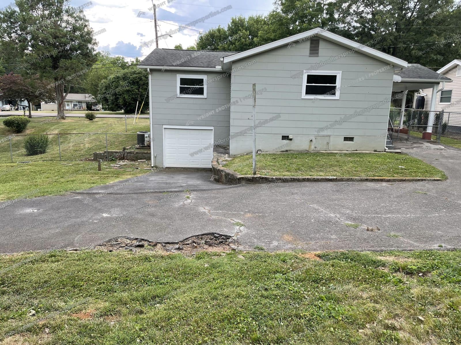 Rear of the house with lower-level garage door