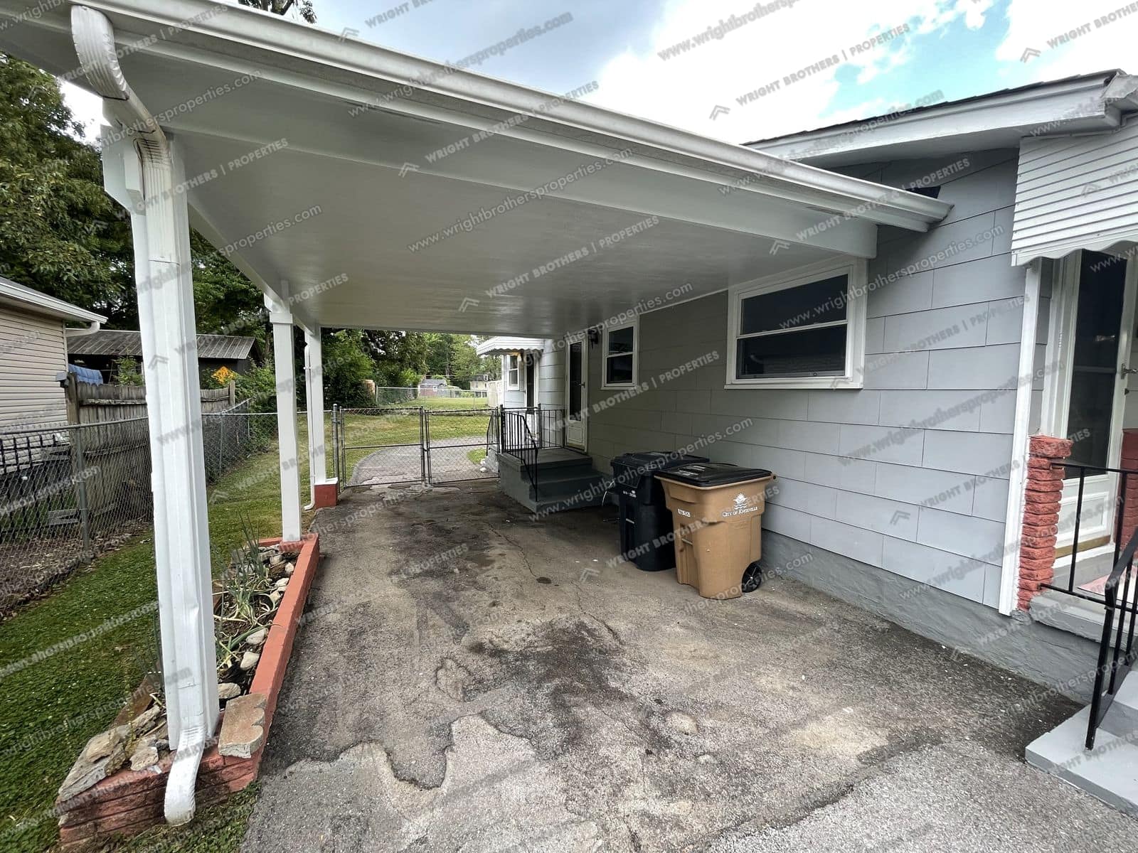 Covered carport along the side of the house