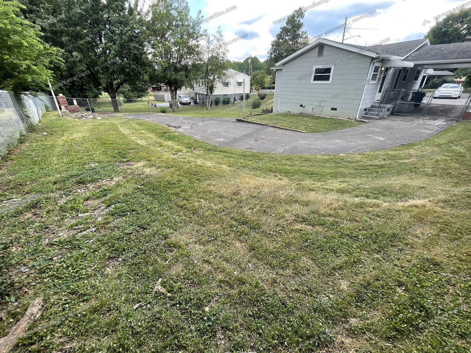 Large yard with chain-link fence
